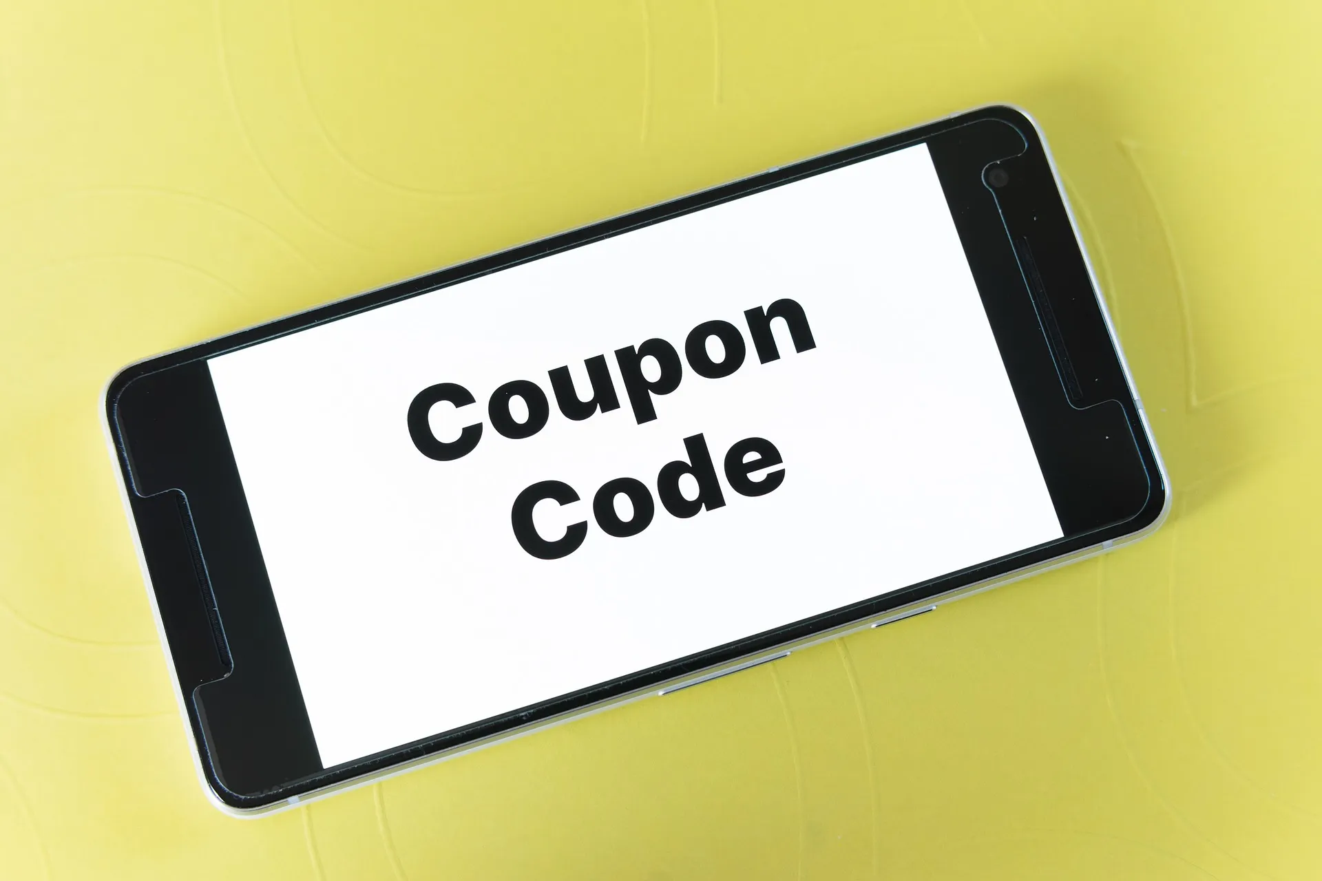 Smartphone showing the words Coupon Code